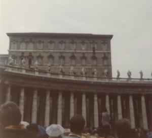 Pope John Paul speaks from tapestry-clad Papal balcony. ( top floor, second window, right)